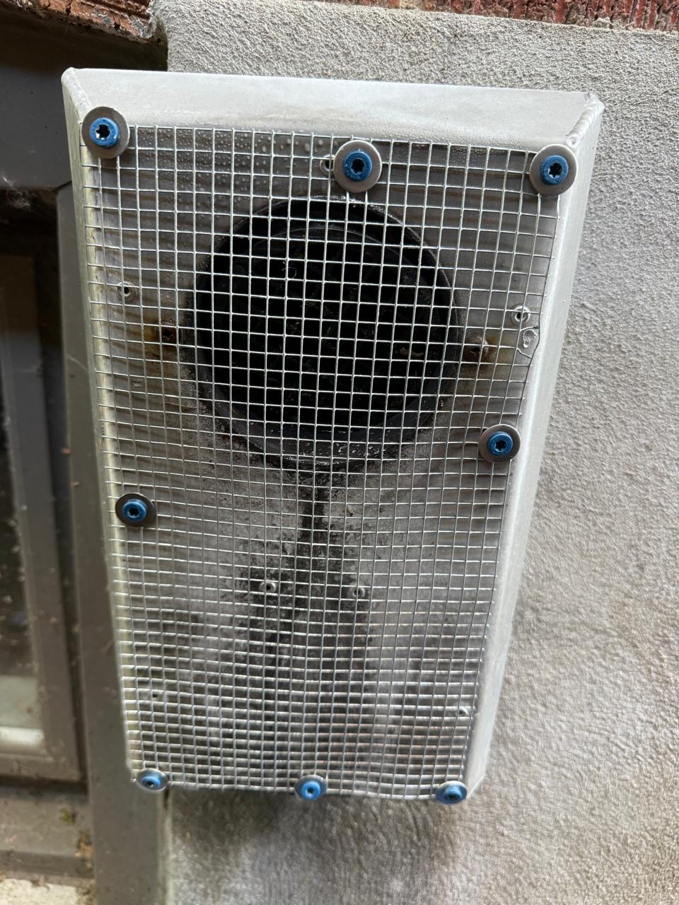 Insect-resistant screening fitted to a suitable building opening to help prevent crawling pest access.