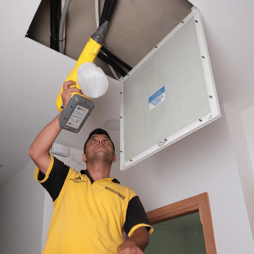 Schtager Canada technician applying professional scenting service in a Toronto commercial space